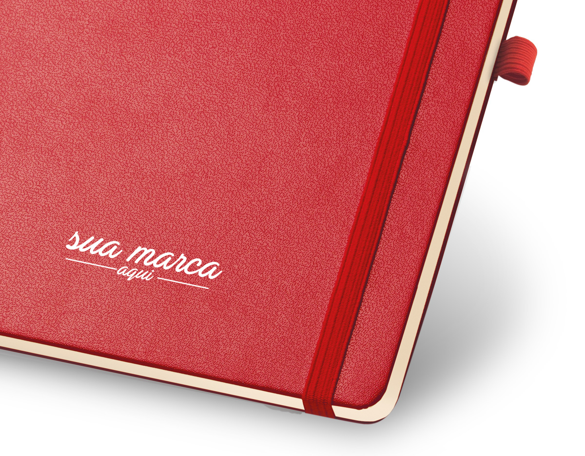 Caderno capa dura, com porta esferográfica, bolso interior folhas não pautadas na cor marfim.