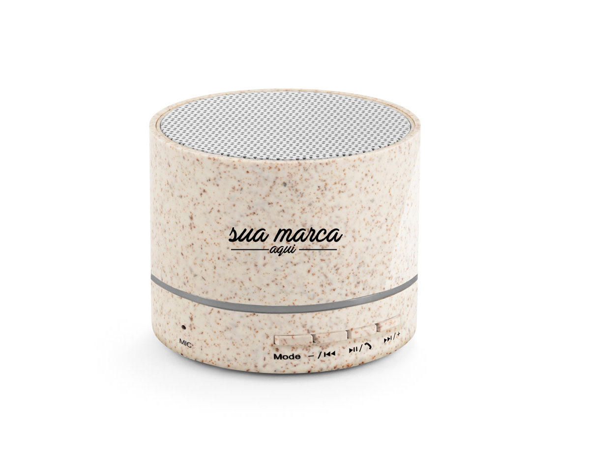 Caixa de som portátil em fibra de palha de trigo e ABS com microfone. Potência de 3W e transmissão por bluetooth 5.0. Com tempo de reprodução de 2 horas e uma bateria de 300 mAh
