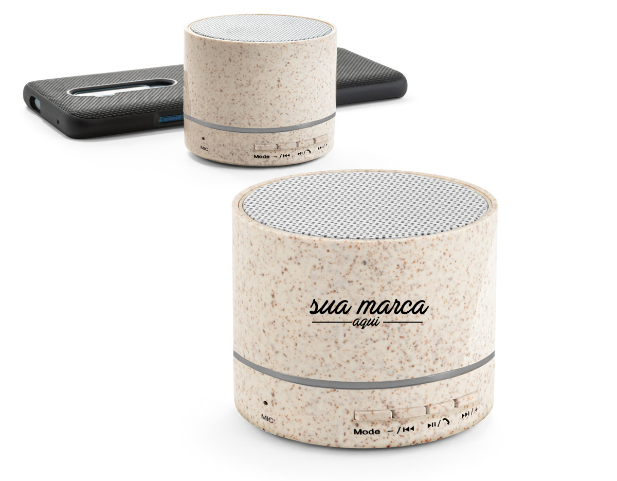 Caixa de som portátil em fibra de palha de trigo e ABS com microfone. Potência de 3W e transmissão por bluetooth 5.0. Com tempo de reprodução de 2 horas e uma bateria de 300 mAh