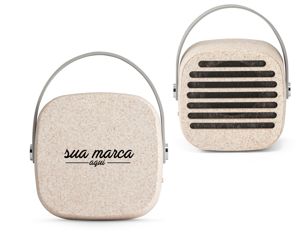 Caixa de som portátil em fibra de palha de trigo e ABS com alça em silicone para facilitar o transporte, potência de 3W e transmissão por bluetooth 5.0. Tempo de reprodução de 4h30, com uma bateria de 500 mAh