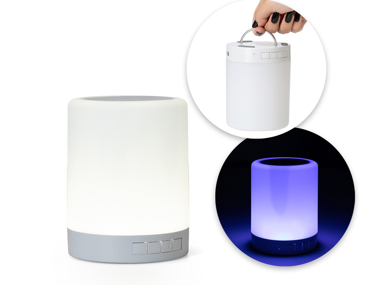 Caixa de som multimídia com luzes. Material plástico resistente na cor branca fosca, parte superior com falante e sensor touch para troca de luzes.