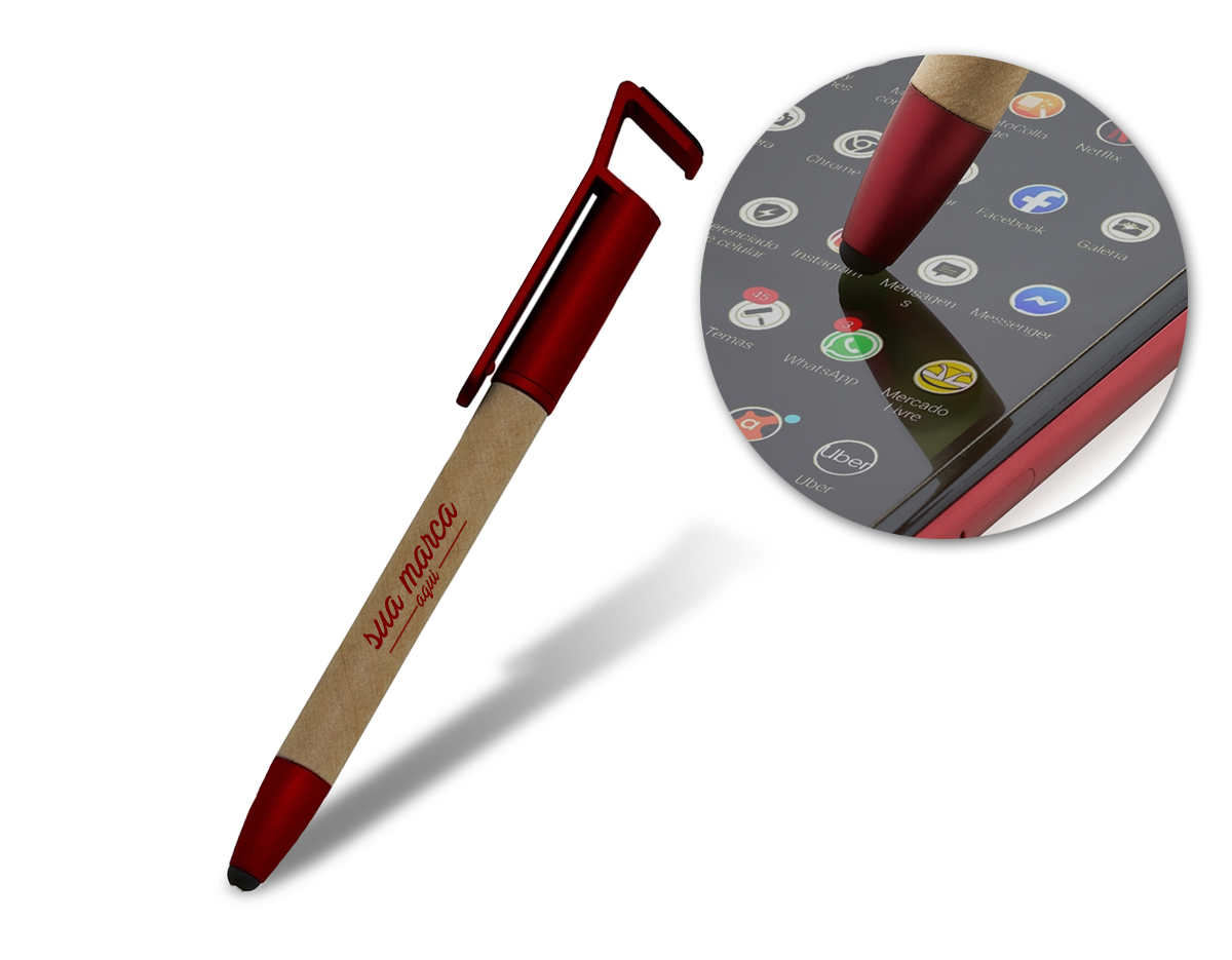 Caneta ecológica touch com suporte para celular, corpo de papelão e detalhes em plástico. Clip aberto utilizado como suporte para o celular e parte superior com limpador de tela. Aciona por giro, carga esferográfica na cor azul.