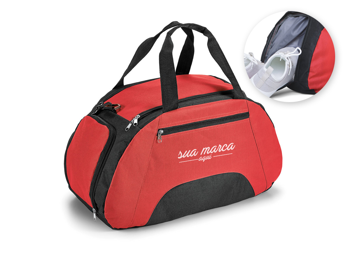 Bolsa esportiva em 600D com divisória interior e fundo com placa semi-rígida. Bolso frontal e bolso lateral para calçado, ambos com zíper. Alça de ombro ajustável