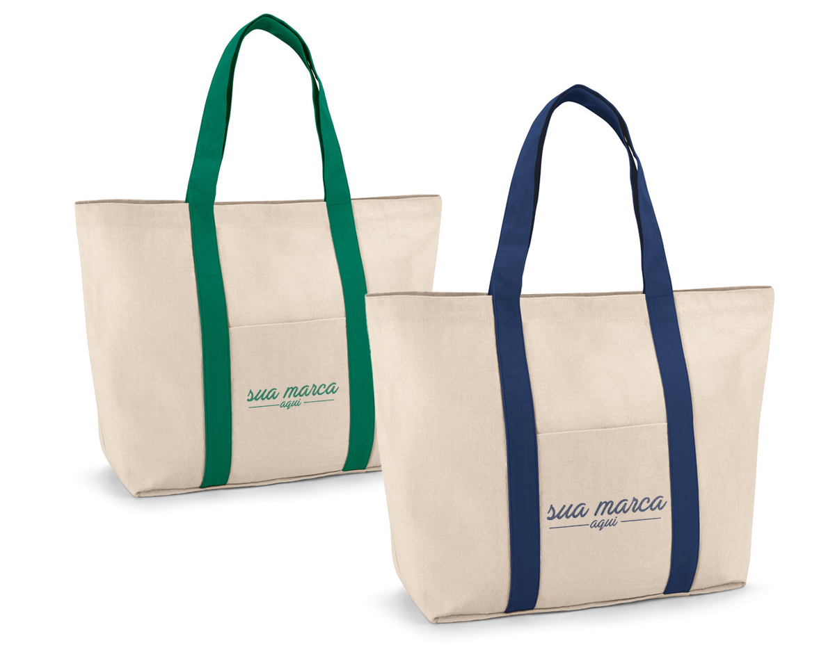 Sacola 100% algodão canvas (280 g/m²) com bolso frontal e bolso interior com zíper. A sacola contém fecho magnético e alças de 60 cm