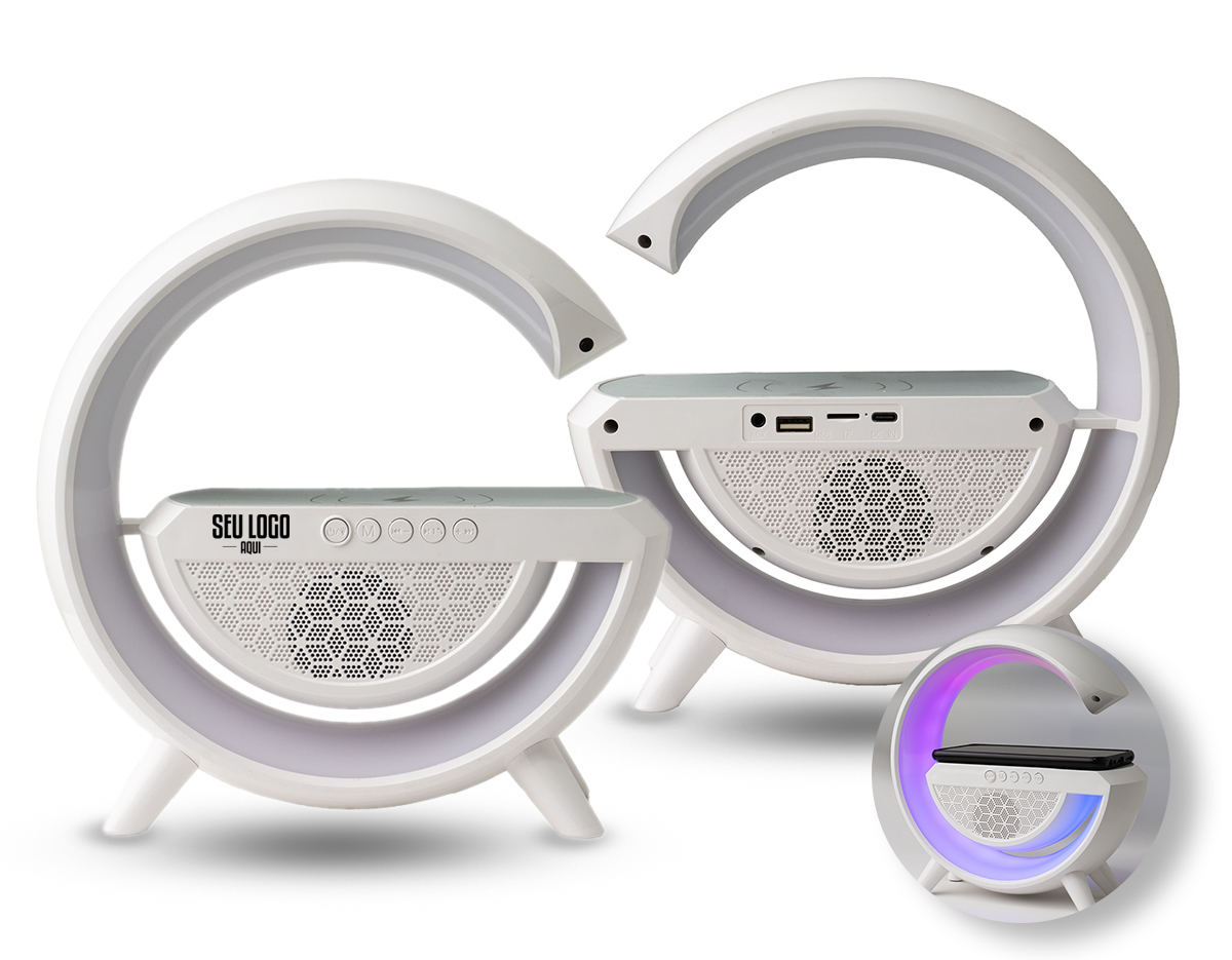 Caixa de som com carregador por indução e luminária. Possui 6 modos de iluminação, opera nos modos bluetooth, rádio FM, auxiliar P2, USB e TF (cartão MicroSD). Para desfrutar do carregamento por indução (sem fio) é fundamental que o celular possua a tecnologia QI, o produto só armazena bateria para funcionamento próprio, para funcionar a indução precisa estar conectado a uma fonte de energia.