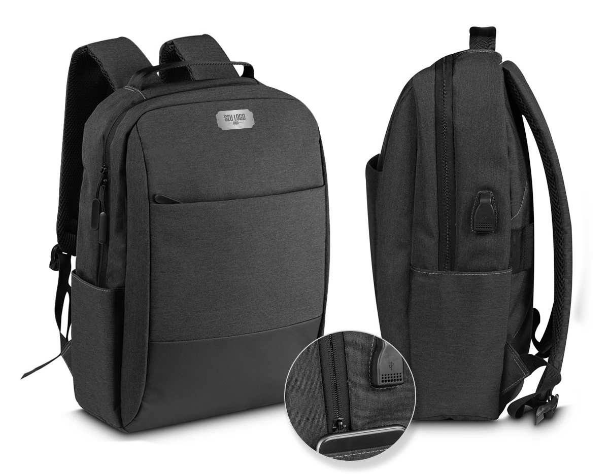 Mochila Pasta produzida em tecido de poliéster e PU, alça de ombro acolchoada, bolsos frontais com zíper,dois compartimentos laterais, aceita notebooks de até 15,6”. Alça de ombro ajustável, porta USB na lateral da mochila, compartimento com zíper na alça de ombro para pequenos objetos.