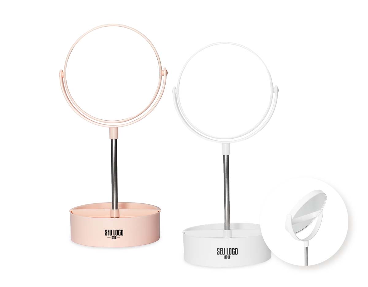 Espelho de mesa dupla face giratório com design moderno e funcional. Com base e moldura de plástico e pedestal de alumínio, ele é fácil de montar e adequa-se bem a qualquer ambiente. Sua base contém três divisórias para guardar objetos diversos.