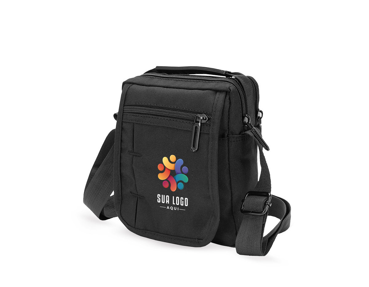 Bolsa de ombro confeccionada em nylon impermeável com alça ajustável para ombros e outra para mão. incluindo um bolso antifurto, um localizado na aba frontal, ambos com fechamento em zíper, e outro na parte interna da aba.