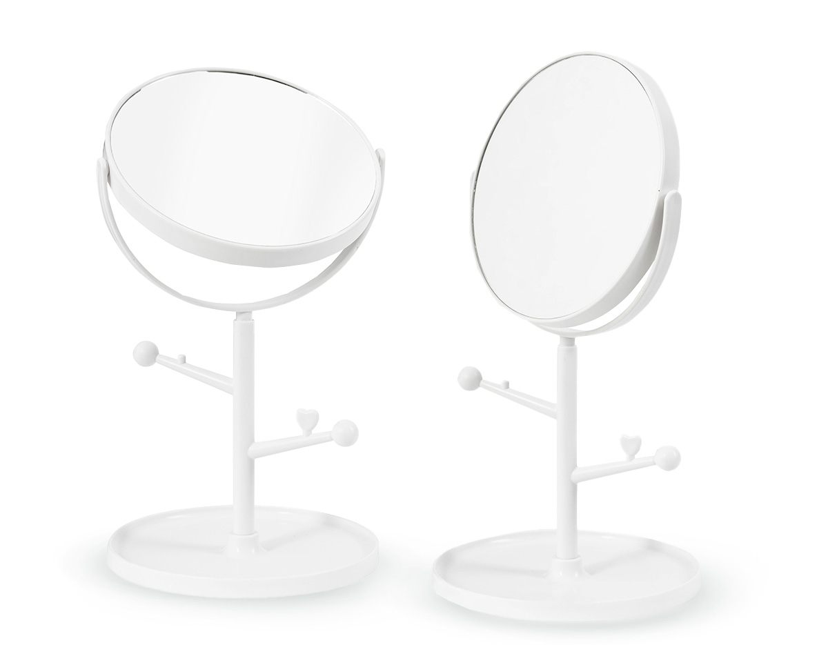 Espelho de mesa dupla face sem aumento. Possui estrutura em plástico com ganchos laterais e base circular para guardar pequenos objetos.